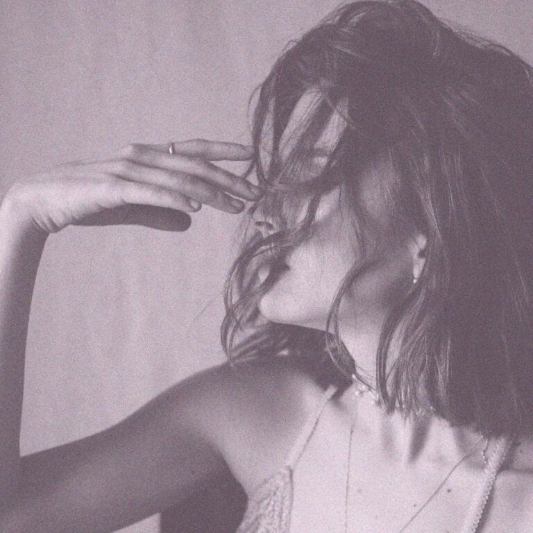 The Velvet Lens Front Page 12 Woman with her head in her hands, expressing sadness and emotional turmoil from ghostlighting